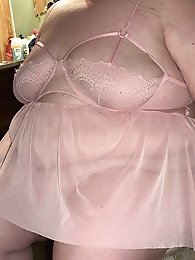 My shy BBW girlfriend is naked in this photo.